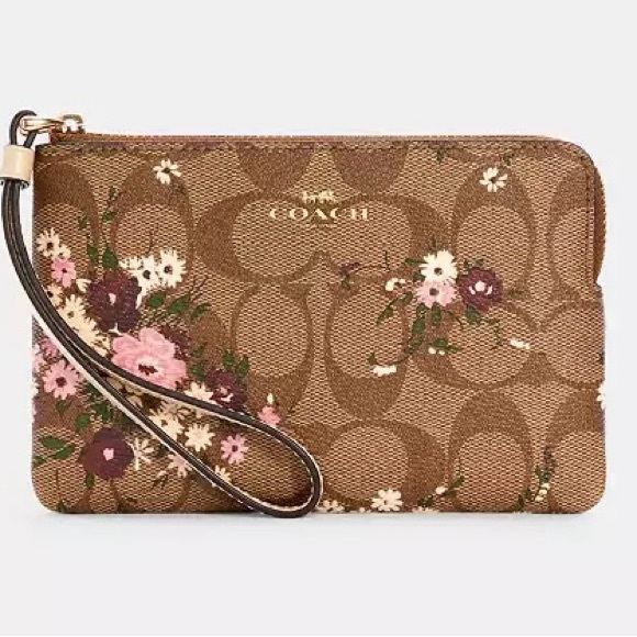 Coach Handbags - 🌼Coach Light Brown Logo & Floral Design Wristlet. Like New.
